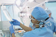 © Tom Merton/Caia Image - Female anesthesiologist preparing IV drip in operating room