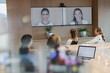 © Tom Merton/Caia Image - Business people talking on monitors in video conference
