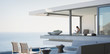 © Tom Merton/Caia Image - Woman sitting on modern, luxury home showcase exterior patio with ocean view