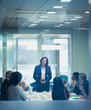 © Robert Daly/Caia Image - Colleagues clapping for businesswoman leading conference room meeting
