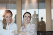 © Tom Merton/Caia Image - Smiling, enthusiastic businesswoman in conference room meeting