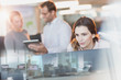 © Tom Merton/Caia Image - Businesswoman using computer in office