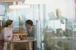 © Tom Merton/Caia Image - Businesswomen talking in conference room meeting