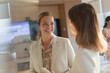 © Tom Merton/Caia Image - Smiling businesswomen talking in office