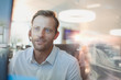 © Tom Merton/Caia Image - Businessman with headset working at computer in office