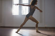 © Sam Edwards/Caia Image - Graceful young female dancer practicing in dance studio