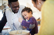 © Sam Edwards/Caia Image - Happy father and son baking in kitchen
