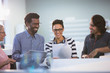 © Tom Merton/Caia Image - Creative business people with digital tablet planning, discussing paperwork in office
