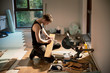 © Tom Merton/Caia Image - Construction worker preparing hardwood flooring in house