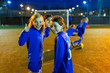 © Paul Bradbury/Caia Image - Portrait confident girl playing soccer, gesturing thumbs-up