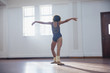 © Sam Edwards/Caia Image - Graceful young female dancer practicing in dance studio