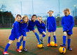 © Paul Bradbury/Caia Image - Portrait confident girls soccer team