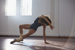 © Sam Edwards/Caia Image - Graceful young female dancer practicing in dance studio