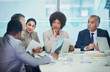 © Robert Daly/Caia Image - Attentive business people listening in conference room meeting