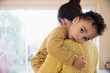 © Sam Edwards/Caia Image - Affectionate mother holding baby son