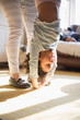 © Sam Edwards/Caia Image - Mother holding happy daughter upside-down