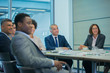 © Robert Daly/Caia Image - Business people listening in conference room meeting