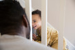 © Sam Edwards/Caia Image - Playful baby boy climbing stairs, smiling at father
