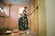 © Tom Merton/Caia Image - Construction workers framing inside of house