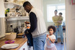 © Sam Edwards/Caia Image - Family baking waffles in kitchen