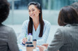 © Robert Daly/Caia Image - Smiling businesswoman in conference room meeting