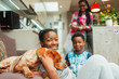 © Paul Bradbury/Caia Image - Portrait smiling family with dog at home
