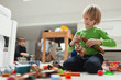 © Paul Bradbury/Caia Image - Curious boy assembling blocks