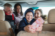 © Sam Edwards/Caia Image - Happy family with smart phone in motor home