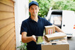 © Tom Merton/Caia Image - Portrait confident deliveryman