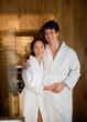 © Tom Merton/Caia Image - Portrait happy couple in bathrobes at spa