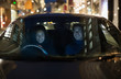 © Tom Merton/Caia Image - Smiling couple driving on city street