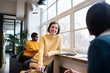 © Sam Edwards/Caia Image - Smiling businesswomen talking in office
