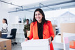 © Sam Edwards/Caia Image - Portrait confident businesswoman moving into new office