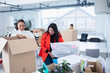 © Sam Edwards/Caia Image - Businesswomen unpacking, moving into new office