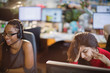 © Tom Merton/Caia Image - Stressed businesswoman with head in hands at computer in office