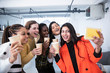 © Sam Edwards/Caia Image - Happy businesswomen celebrating, taking selfie