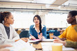 © Sam Edwards/Caia Image - Businesswomen talking in meeting