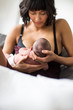 © Sam Edwards/Caia Image - Mother breastfeeding newborn baby son