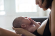 © Sam Edwards/Caia Image - Mother holding newborn baby son