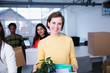 © Sam Edwards/Caia Image - Portrait confident businesswoman moving into new office