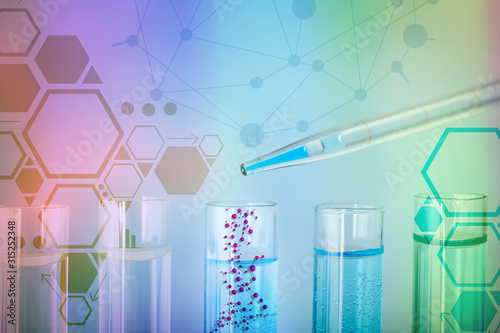 Dripping of color sample into test tube against color background