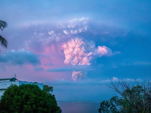 Taal Volcano Eruption At Sunset, Its Plume Visible In The Sky Over The Lights Of Batangas City, Viewed From Mindoro Island, 30 Miles Away, On Jan 12, 2020.