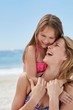 © Science RF - Mother and daughter laughing on beach