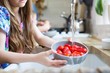 © Science RF - Girl washing fresh strawberries