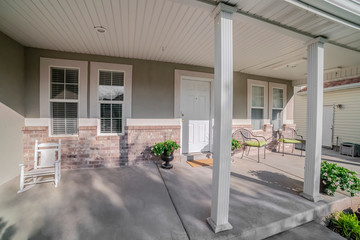 Wall Mural - Covered veranda with chairs and front door