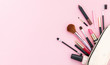 © Rawf8 - Make-up cosmetic bag against pink background, copy space
