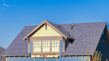 Wall Mural - Panorama frame Large triple dormer window in an urban house