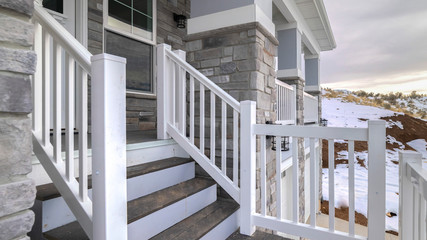 Wall Mural - Panorama Winding wooden stairs to a house front door