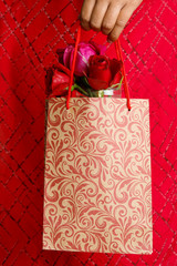 Canvas Print - Bouquet of red roses and gift box on white background.