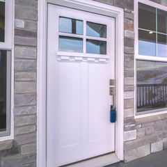 Wall Mural - Square White wooden front door with sash windows